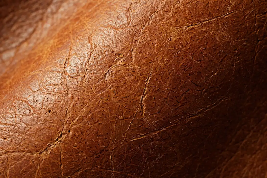 Top-grain leather texture close-up for The Heritage Cafe Racer