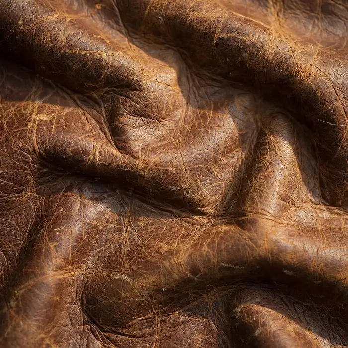 Genuine leather texture close-up for The Distressed Roadster