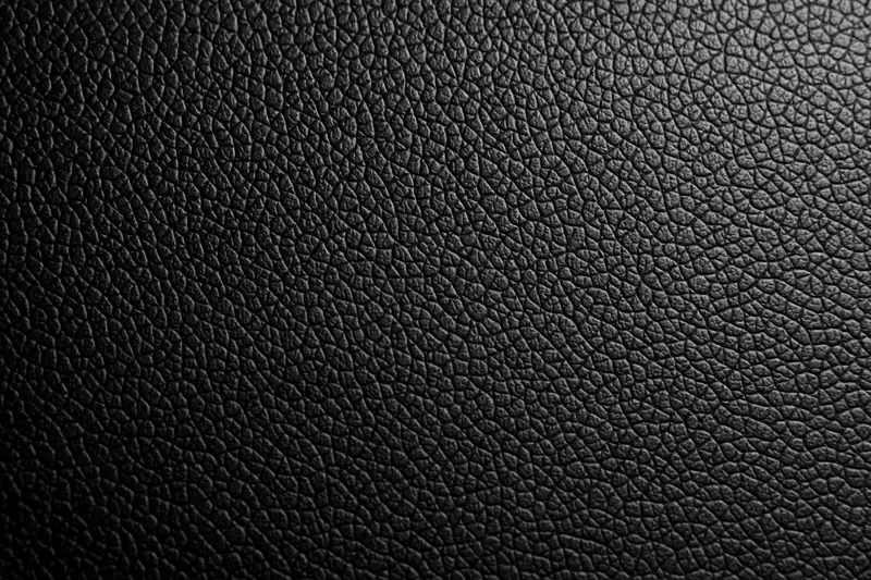 Faux leather (synthetic) texture close-up for The Men's Faux Leather Bomber